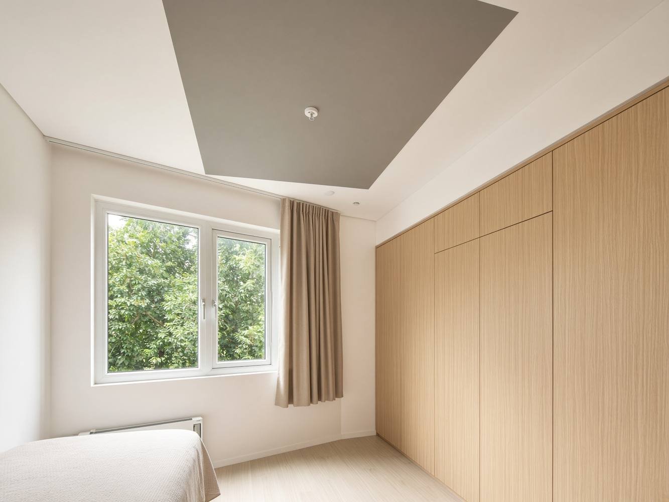 Freshly painted Singapore HDB bedroom with even warm-white walls